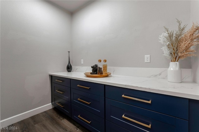 bathroom with vanity and hardwood / wood-style floors