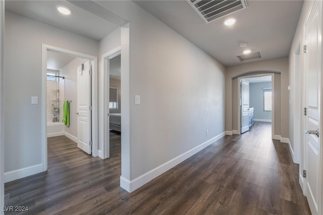 hallway with dark hardwood / wood-style floors