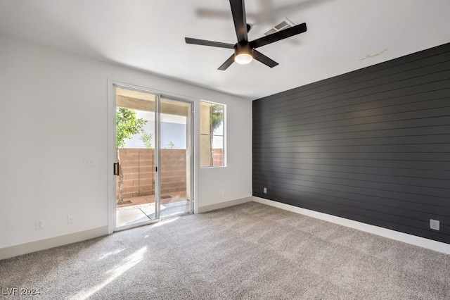 carpeted empty room with ceiling fan