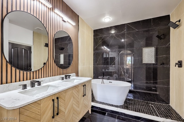 bathroom featuring vanity, tile patterned floors, tile walls, and plus walk in shower