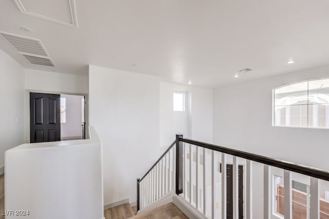 hallway with light hardwood / wood-style flooring