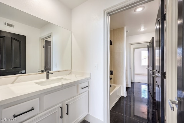 bathroom with vanity, shower / tub combination, and tile patterned flooring