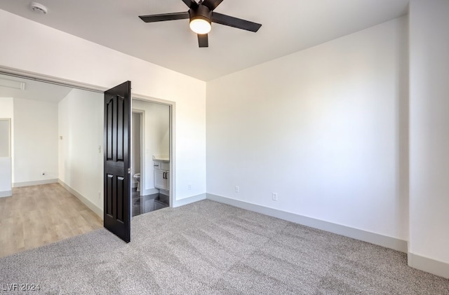 empty room with light carpet and ceiling fan