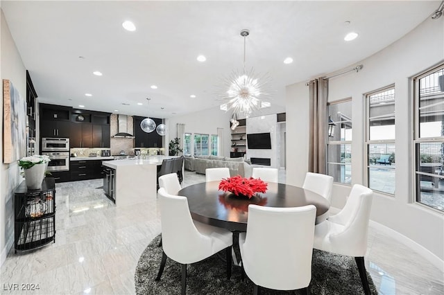 dining space with a chandelier