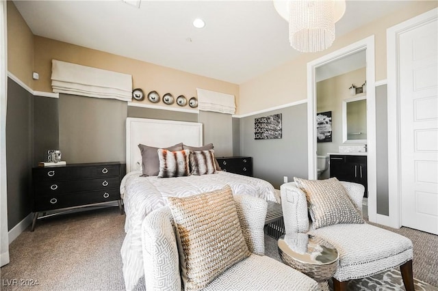 bedroom featuring carpet and ensuite bath