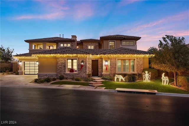 mediterranean / spanish house featuring a garage