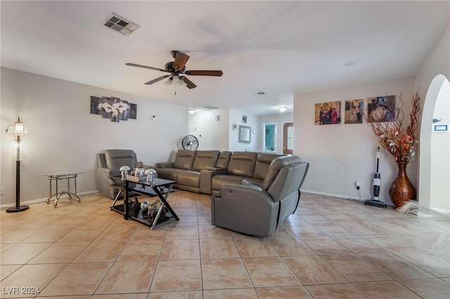 living room with light tile patterned floors and ceiling fan