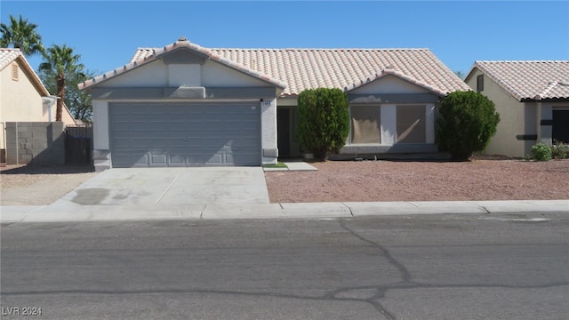 ranch-style house featuring a garage