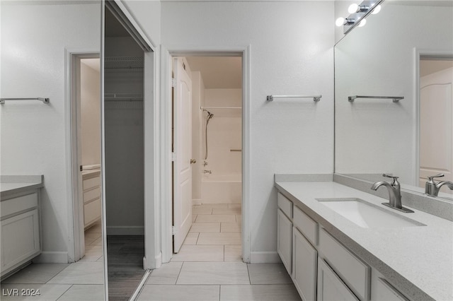 bathroom featuring shower / bath combination and vanity