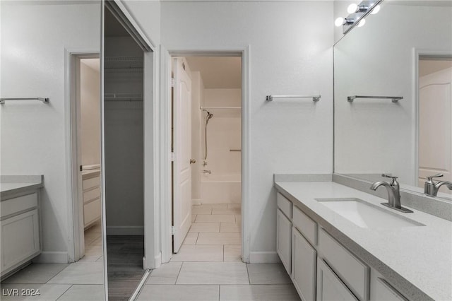 7400 W Flamingo Rd Unit 2013, Las Vegas, NV 89147 - full bath with vanity, a walk in closet, and baseboards