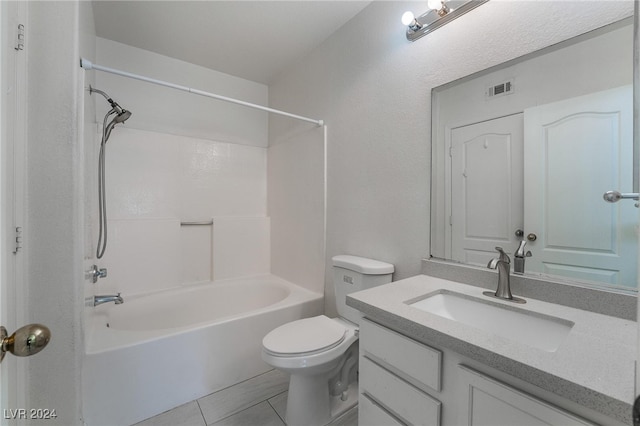 full bathroom featuring toilet, vanity, tile patterned floors, and  shower combination