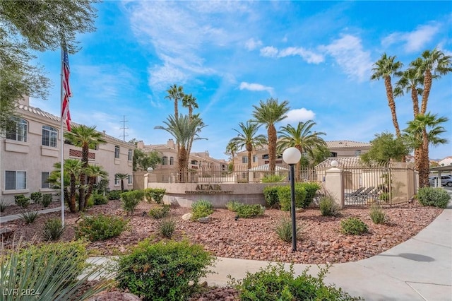 7400 W Flamingo Rd Unit 2013, Las Vegas, NV 89147 - view of property's community featuring a residential view, a fenced front yard, and a gate