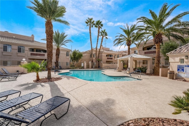 view of swimming pool with a patio area