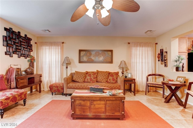 living room with plenty of natural light and ceiling fan