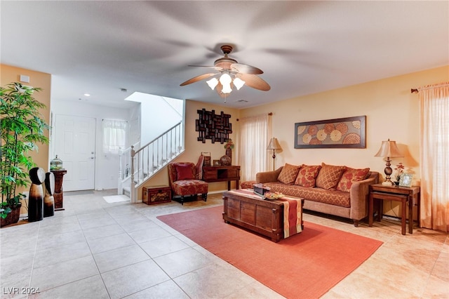 tiled living room featuring ceiling fan