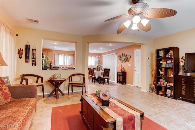 living room with light tile patterned flooring and ceiling fan