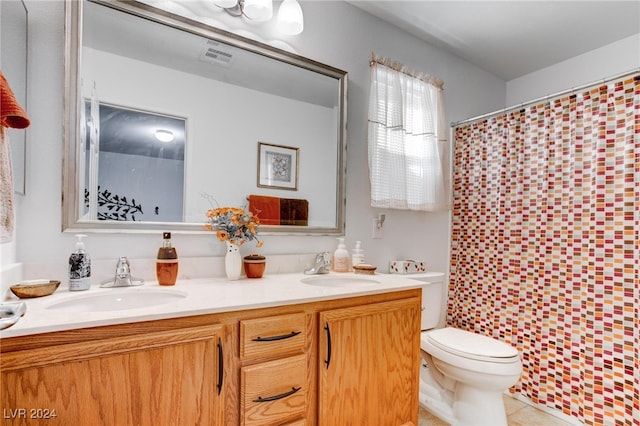 bathroom featuring vanity, toilet, tile patterned flooring, and a shower with shower curtain