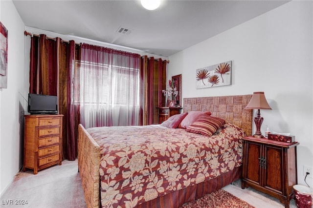 bedroom featuring light colored carpet