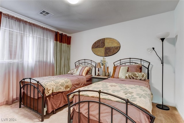 carpeted bedroom featuring a textured ceiling