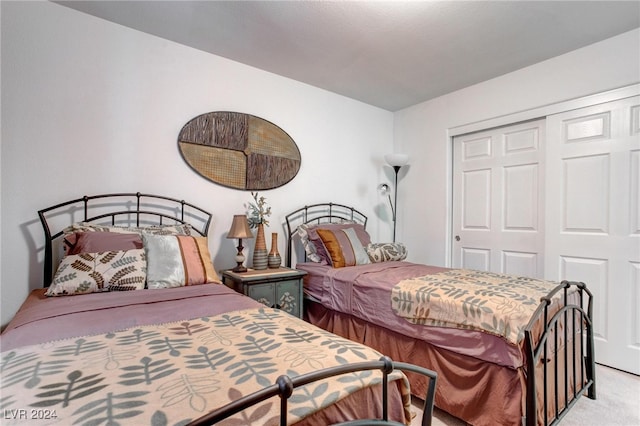 carpeted bedroom featuring a closet