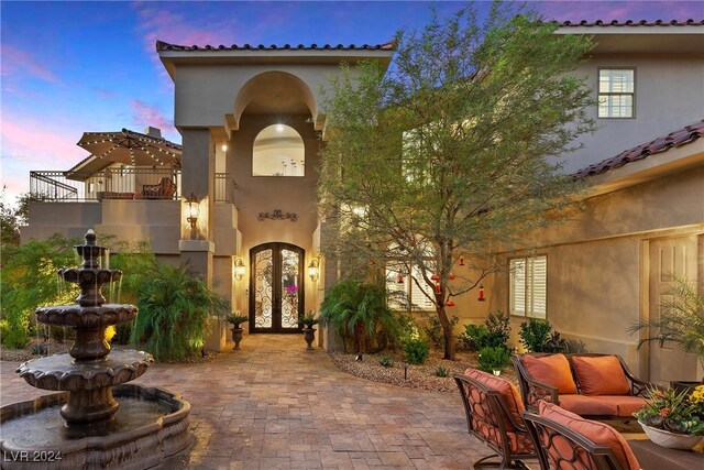 exterior space with french doors and a balcony