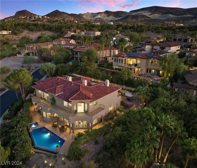 aerial view at dusk with a mountain view