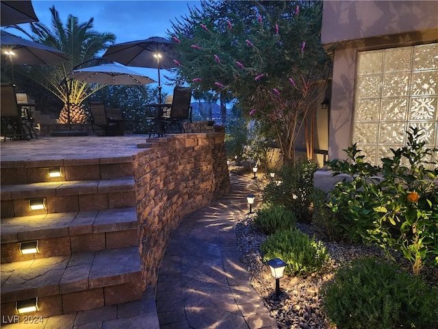 view of patio terrace at dusk