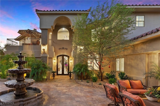 exterior space featuring french doors and a balcony