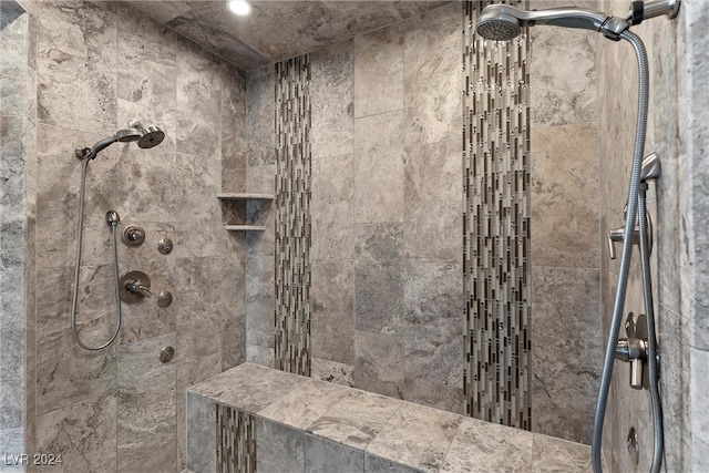 bathroom featuring tiled shower