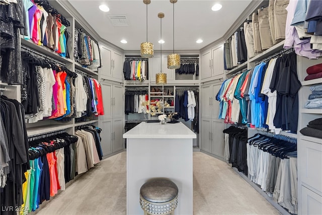 walk in closet featuring light colored carpet