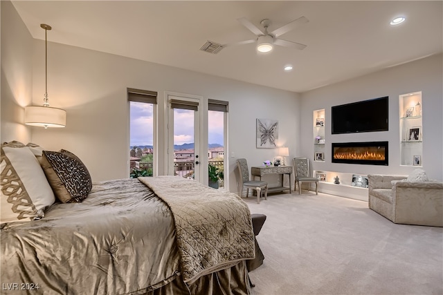 carpeted bedroom with access to outside and ceiling fan