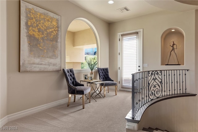 sitting room with light carpet