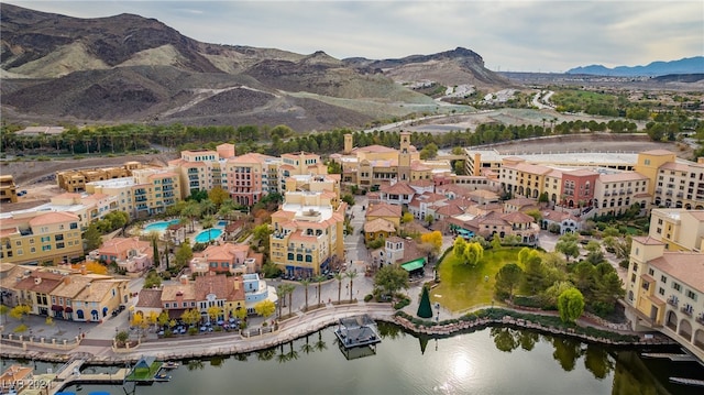 bird's eye view with a water and mountain view