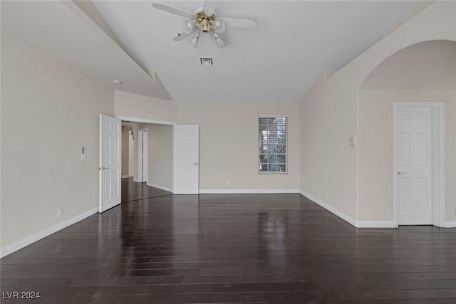 1931 Fox Canyon Cir, Las Vegas, NV 89117 - spare room with lofted ceiling, arched walkways, ceiling fan, wood finished floors, and baseboards