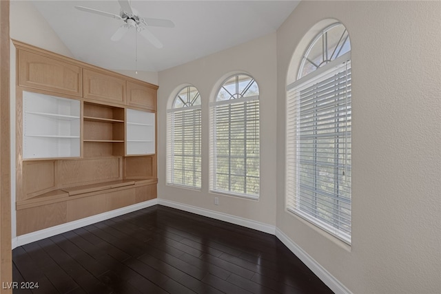 unfurnished room featuring dark hardwood / wood-style flooring, ceiling fan, and a healthy amount of sunlight