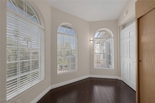 1931 Fox Canyon Cir, Las Vegas, NV 89117 - unfurnished dining area with baseboards and dark wood-style floors