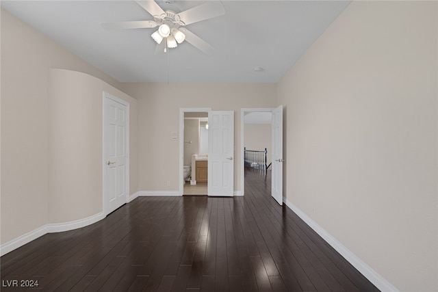 unfurnished room featuring ceiling fan and dark hardwood / wood-style floors