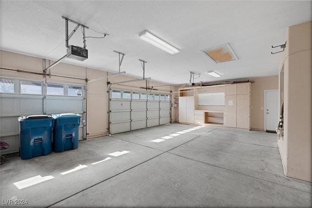 garage featuring a garage door opener