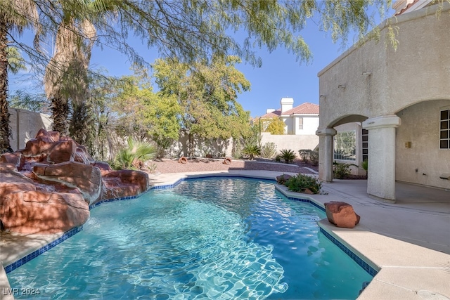 view of pool featuring a patio and pool water feature