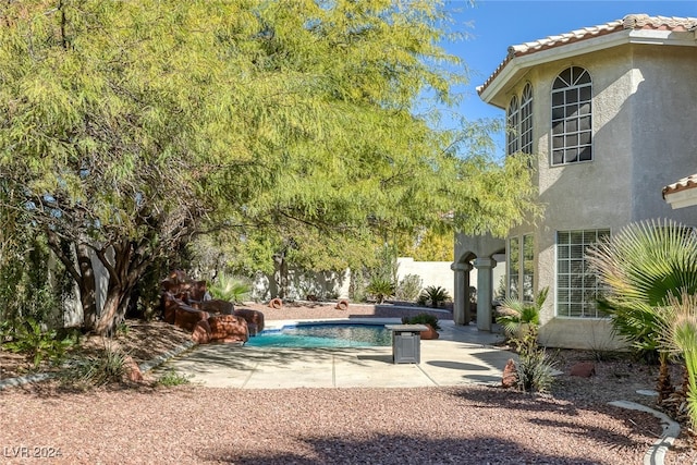 view of swimming pool with a patio