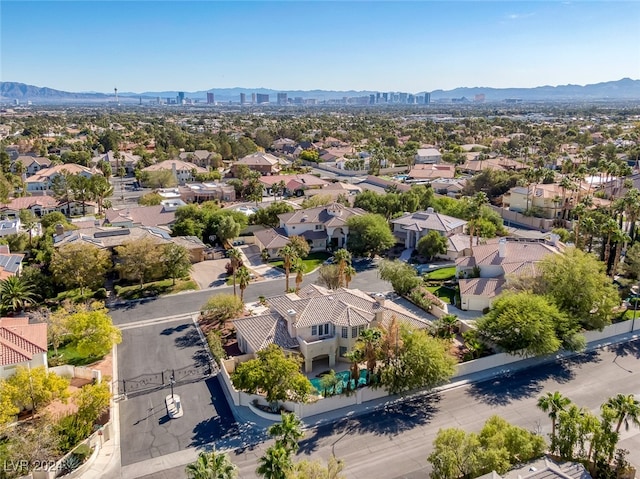 birds eye view of property with a mountain view