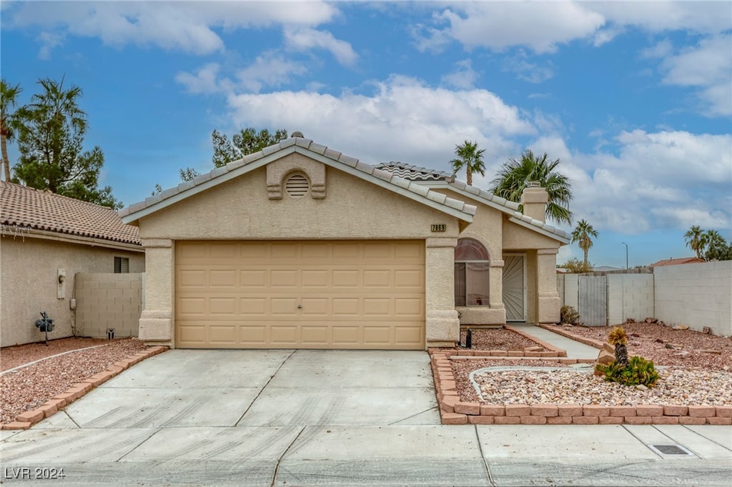 ranch-style home featuring a garage