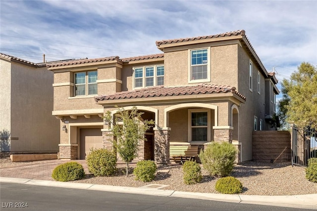 6370 Ava Ridge Ave, Las Vegas, NV 89141 - view of front facade with covered porch, an attached garage, stucco siding, and stone siding