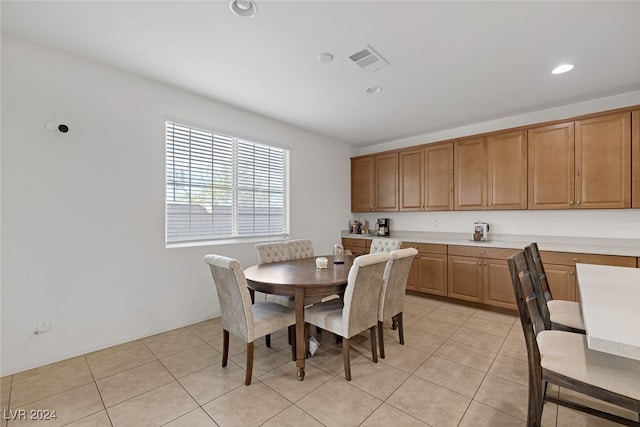 dining area with light tile patterned flooring