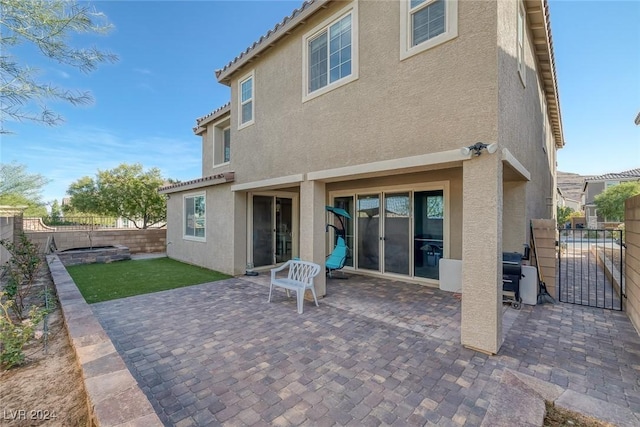 6370 Ava Ridge Ave, Las Vegas, NV 89141 - back of property with stucco siding, a fenced backyard, a patio area, and a gate