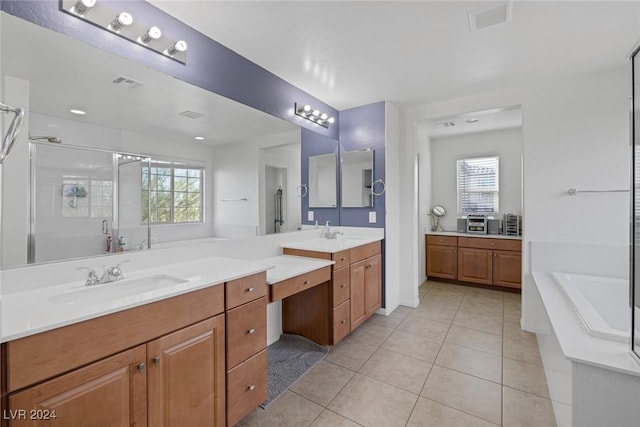 6370 Ava Ridge Ave, Las Vegas, NV 89141 - full bath featuring two vanities, a garden tub, tile patterned flooring, a shower stall, and healthy amount of natural light