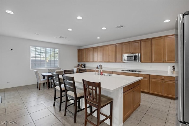 6370 Ava Ridge Ave, Las Vegas, NV 89141 - kitchen with appliances with stainless steel finishes, a sink, light tile patterned floors, light countertops, and recessed lighting