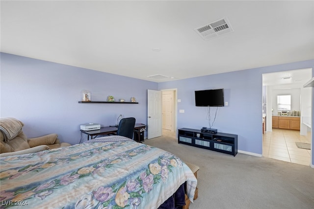 carpeted bedroom featuring connected bathroom