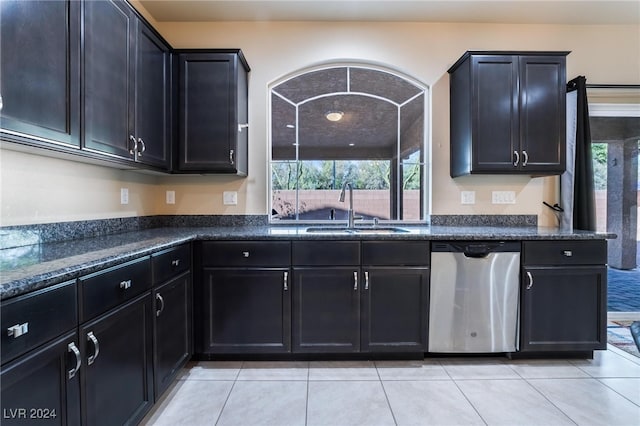 kitchen featuring sink, light tile patterned flooring, and dishwasher