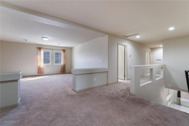 spare room with light carpet